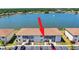 Waterfront condo building with lush landscaping and ample parking at 25275 Rampart Blvd # 1203, Punta Gorda, FL 33983