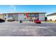 Exterior of condo building with parking in front at 25275 Rampart Blvd # 1203, Punta Gorda, FL 33983