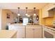 Open kitchen with white cabinetry and modern appliances at 25275 Rampart Blvd # 1203, Punta Gorda, FL 33983