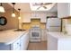 Modern kitchen with white cabinets and appliances at 25275 Rampart Blvd # 1203, Punta Gorda, FL 33983