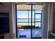 Serene lanai with panoramic water views, seating area and easy access to indoor living spaces at 25275 Rampart Blvd # 1203, Punta Gorda, FL 33983