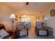 Inviting living room with comfortable seating, tile floors and seamless flow into the dining area and kitchen at 25275 Rampart Blvd # 1203, Punta Gorda, FL 33983