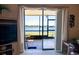 Relaxing screened patio showcases water view, offering a serene outdoor living space at 25275 Rampart Blvd # 1203, Punta Gorda, FL 33983