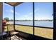Enjoy water views from this cozy screened-in lanai with seating, creating a private oasis at 25275 Rampart Blvd # 1203, Punta Gorda, FL 33983