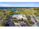 Beautiful aerial view of the community clubhouse, golf course, and waterfront at 2912 Fiddlers Bnd, Palmetto, FL 34221