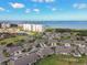 Landscaped community featuring low-rise condos and attached villas near the water at 2912 Fiddlers Bnd, Palmetto, FL 34221