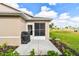 Cozy back patio with a grill, lush landscaping, and access to the beautiful surroundings, perfect for outdoor gatherings at 2912 Fiddlers Bnd, Palmetto, FL 34221