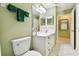 Bathroom with a double mirror, ample lighting, and a commode for a comfortable experience at 2912 Fiddlers Bnd, Palmetto, FL 34221