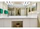 Bathroom with double sinks, white cabinetry, and a spacious vanity area at 2912 Fiddlers Bnd, Palmetto, FL 34221