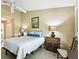 Comfortable bedroom featuring a bed and bedside tables with lamps at 2912 Fiddlers Bnd, Palmetto, FL 34221