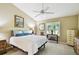 Cozy bedroom featuring a large bed, ample natural light, and neutral tones at 2912 Fiddlers Bnd, Palmetto, FL 34221