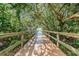 Picturesque boardwalk path through lush greenery, offering a tranquil experience at 2912 Fiddlers Bnd, Palmetto, FL 34221