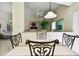 Charming dining area with an open floor plan offers seamless transition to living spaces and outdoor views at 2912 Fiddlers Bnd, Palmetto, FL 34221