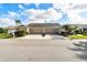 Well maintained home featuring an attached two-car garage, neat landscaping, and a charming mailbox at 2912 Fiddlers Bnd, Palmetto, FL 34221