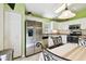 Bright kitchen featuring stainless steel appliances, white cabinetry, and granite countertops at 2912 Fiddlers Bnd, Palmetto, FL 34221