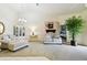 Comfortable living room with neutral carpet, chandelier, and cozy seating area at 2912 Fiddlers Bnd, Palmetto, FL 34221