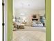Cozy living room with ceramic tile entrance, carpet, and opening to bedroom at 2912 Fiddlers Bnd, Palmetto, FL 34221