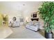 Open living room with carpet, bright natural light, and neutral color scheme at 2912 Fiddlers Bnd, Palmetto, FL 34221