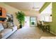 Relaxing living room with ceiling fan, comfortable seating, and large indoor plant at 2912 Fiddlers Bnd, Palmetto, FL 34221