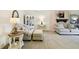Carpeted living room featuring stylish furniture, decor, and ample natural light at 2912 Fiddlers Bnd, Palmetto, FL 34221
