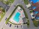 Overhead shot of a pool with lounge chairs and shade structures at 2912 Fiddlers Bnd, Palmetto, FL 34221