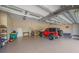 Spacious garage with high ceilings, ample lighting, and a work area at 29527 Leah Rd, Punta Gorda, FL 33982