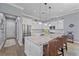 Bright kitchen features stainless appliances, granite counters, subway tile backsplash, and pendant lighting at 29527 Leah Rd, Punta Gorda, FL 33982