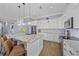 Modern kitchen features stainless steel appliances, white cabinetry, and a large center island at 29527 Leah Rd, Punta Gorda, FL 33982