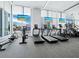 Bright gym with new treadmills, exercise bikes, and waterfront views at 301 Quay Commons # 1708, Sarasota, FL 34236