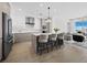 Bright, open kitchen featuring an island with barstool seating and stainless steel appliances at 301 Quay Commons # 1708, Sarasota, FL 34236
