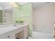 Bathroom with a shower-tub combo and a large countertop at 3328 Dartmouth Ln # 1012, Sarasota, FL 34239