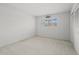 Bright bedroom featuring neutral walls and a large window at 3328 Dartmouth Ln # 1012, Sarasota, FL 34239