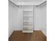 Bright, organized closet with shelving and clothing rod at 3328 Dartmouth Ln # 1012, Sarasota, FL 34239