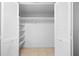 Spacious walk-in closet with shelves and ample storage at 3328 Dartmouth Ln # 1012, Sarasota, FL 34239