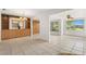 The dining room features built in storage and large windows, perfect for entertaining at 3328 Dartmouth Ln # 1012, Sarasota, FL 34239