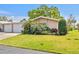 Charming single-story home featuring mature landscaping and an attached two-car garage at 3328 Dartmouth Ln # 1012, Sarasota, FL 34239
