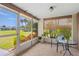 Relaxing lanai with views of the lush landscaping and serene community at 3328 Dartmouth Ln # 1012, Sarasota, FL 34239