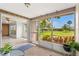 Enclosed lanai featuring beautiful views of the landscaped yard and community at 3328 Dartmouth Ln # 1012, Sarasota, FL 34239