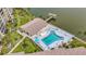 Overhead view of community pool and clubhouse set on a lake with a dock perfect for outdoor enjoyment at 3821 Lake Bayshore Dr # H-507, Bradenton, FL 34205