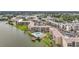 Aerial view showcases lakeside condos with ample parking and scenic views of the lake at 3821 Lake Bayshore Dr # H-507, Bradenton, FL 34205