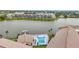 Scenic aerial perspective of a community pool and adjacent lake, offering a tranquil and picturesque setting at 3821 Lake Bayshore Dr # H-507, Bradenton, FL 34205