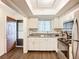 Bright kitchen featuring white cabinets, stainless appliances, and granite countertops, ideal for cooking and entertaining at 3821 Lake Bayshore Dr # H-507, Bradenton, FL 34205