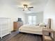 Bright bedroom featuring balcony access, wood-look flooring, and ample natural light at 3821 Lake Bayshore Dr # H-507, Bradenton, FL 34205