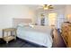 Serene bedroom with wood floors, a walk-in closet, and an en-suite bathroom at 3821 Lake Bayshore Dr # H-507, Bradenton, FL 34205