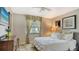 This bedroom features neutral decor, a cozy window, and bright natural light at 3842 Glen Oaks Manor Dr, Sarasota, FL 34232