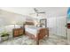 Comfortable bedroom featuring a ceiling fan and two door closets at 3842 Glen Oaks Manor Dr, Sarasota, FL 34232