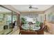 Cozy dining area connects to the lanai with comfortable seating and bright light at 3842 Glen Oaks Manor Dr, Sarasota, FL 34232