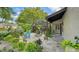 Charming outdoor seating area with lovely garden views; perfect for relaxing outdoors at 3842 Glen Oaks Manor Dr, Sarasota, FL 34232