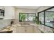 Charming kitchen boasts stainless sink, subway tile backsplash, and granite countertops at 3842 Glen Oaks Manor Dr, Sarasota, FL 34232