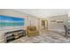 Comfortable living area with neutral colors, wall mirror and recessed lighting at 3842 Glen Oaks Manor Dr, Sarasota, FL 34232